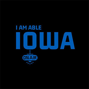 Blue text on a black background reads "I AM ABLE IOWA ON AIR".
